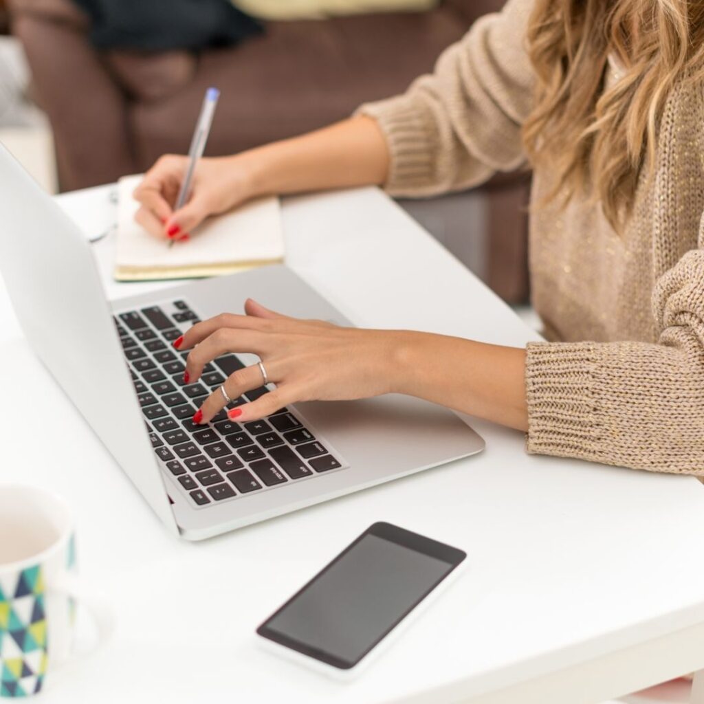 Top View of Woman Working on Laptop